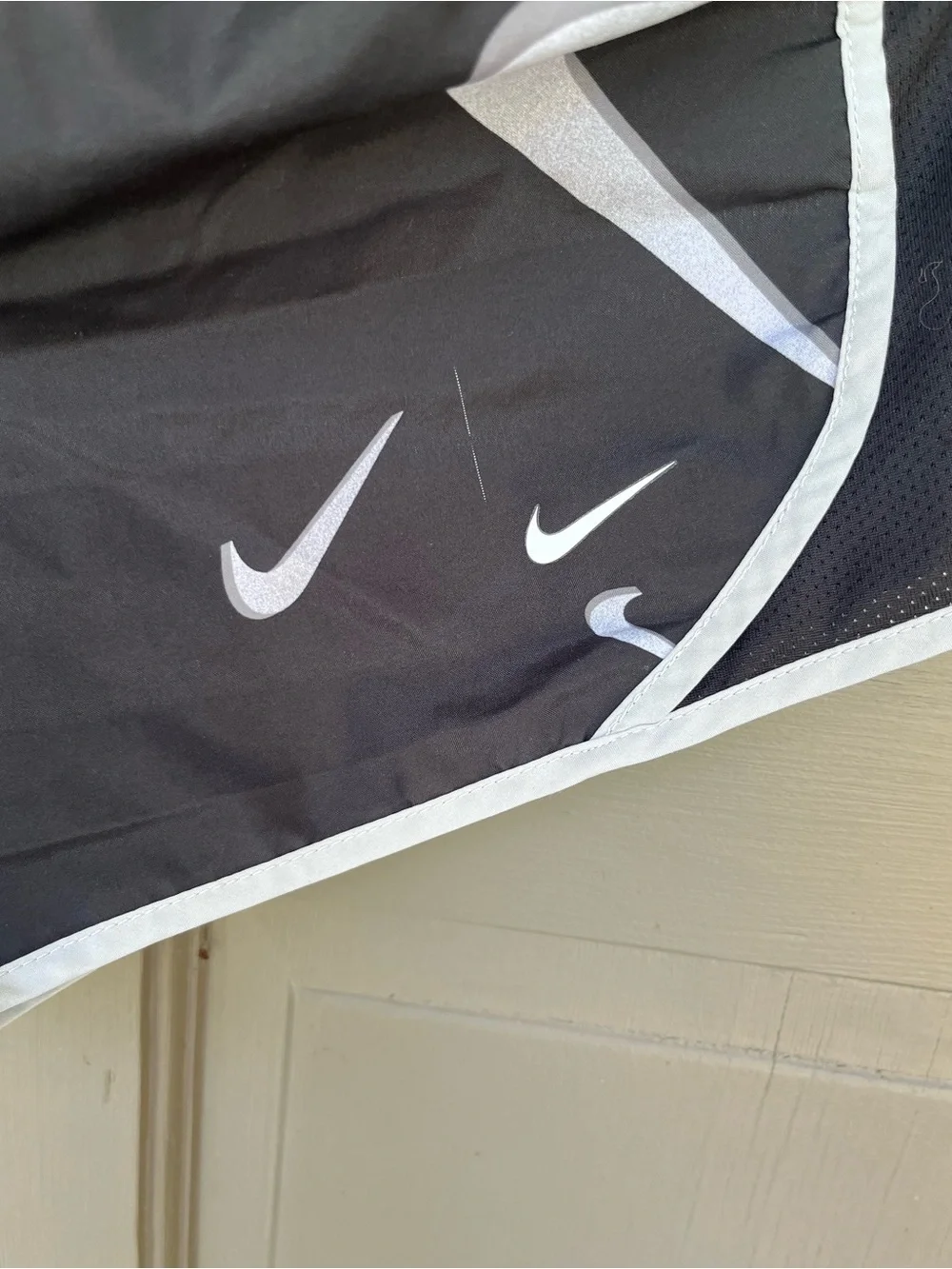 Nike Black Shorts with White Swoosh Print